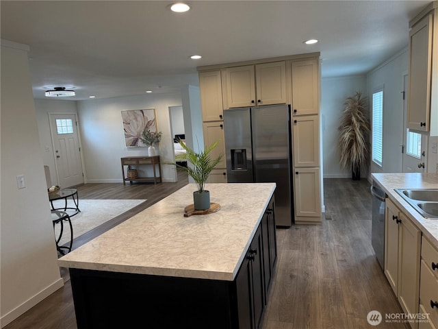 702 Bryce Pl SW, Mattawa, WA 99349 - kitchen with stainless steel appliances, baseboards, light countertops, dark wood-style floors, and recessed lighting