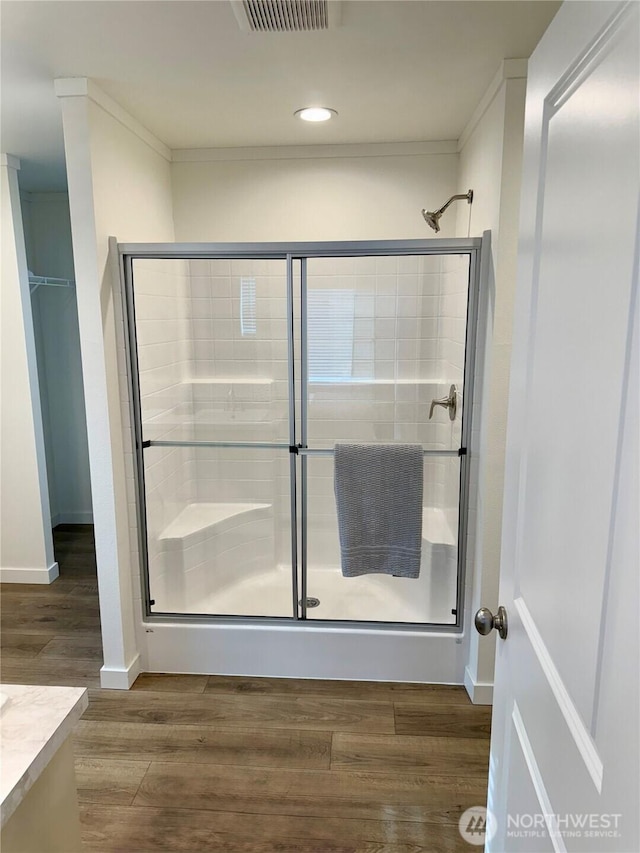702 Bryce Pl SW, Mattawa, WA 99349 - full bathroom featuring a shower stall, recessed lighting, wood finished floors, and baseboards