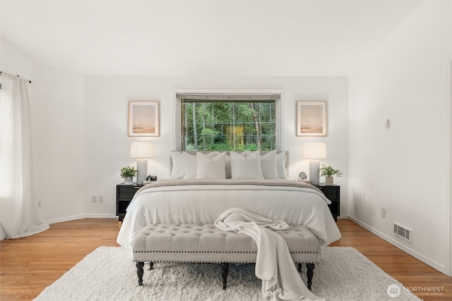 464 7th Ave, Fox Island, WA 98333 - bedroom featuring light wood-style flooring and baseboards