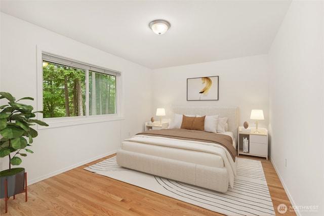 464 7th Ave, Fox Island, WA 98333 - bedroom with light wood-style floors and baseboards