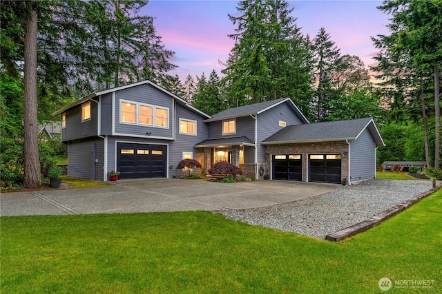 464 7th Ave, Fox Island, WA 98333 - view of front of home with concrete driveway, a front yard, and an attached garage