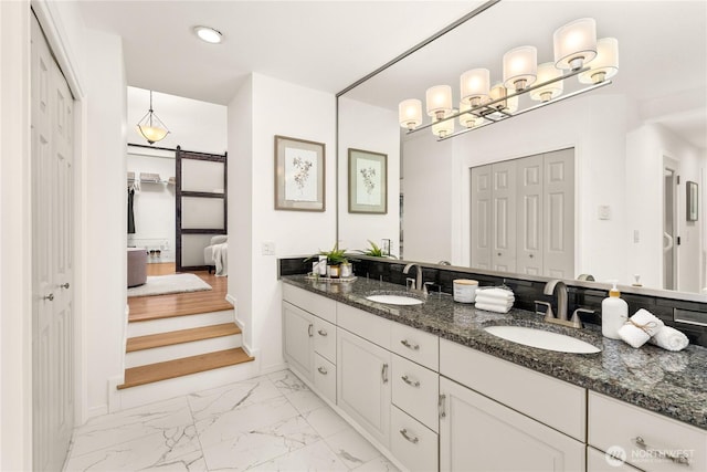 464 7th Ave, Fox Island, WA 98333 - ensuite bathroom with marble finish flooring, a closet, double vanity, baseboards, and recessed lighting