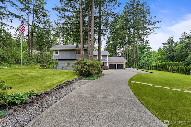 464 7th Ave, Fox Island, WA 98333 - view of front of property with driveway, a front lawn, and an attached garage