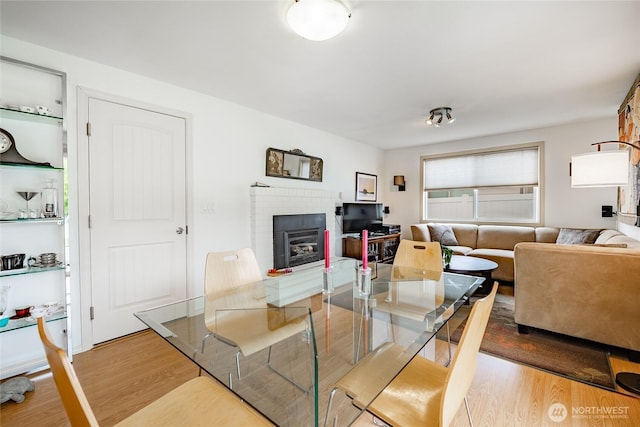 8039 Niska Rd, Blaine, WA 98230 - dining room with wood finished floors and a fireplace