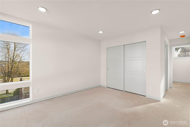 5517A 9th Ave NW, Seattle, WA 98107 - unfurnished bedroom with baseboards, recessed lighting, and a closet