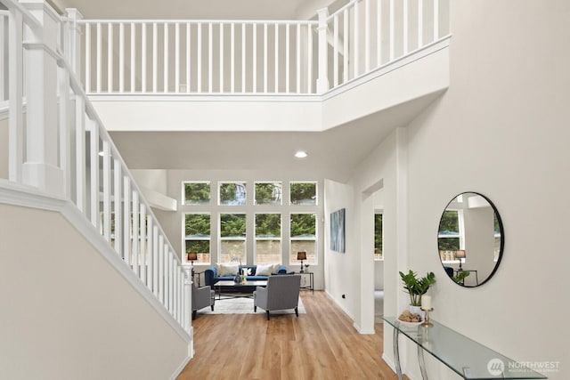 1417 241st Pl SE, Sammamish, WA 98075 - living area featuring a high ceiling, stairway, light wood-type flooring, and recessed lighting