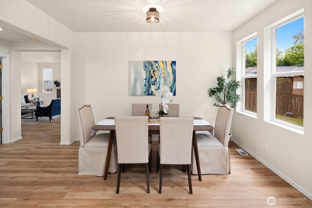 1417 241st Pl SE, Sammamish, WA 98075 - dining area with light wood finished floors and baseboards