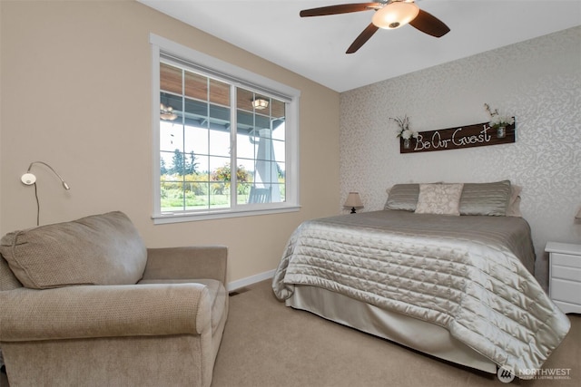 bedroom with carpet flooring, baseboards, and a ceiling fan