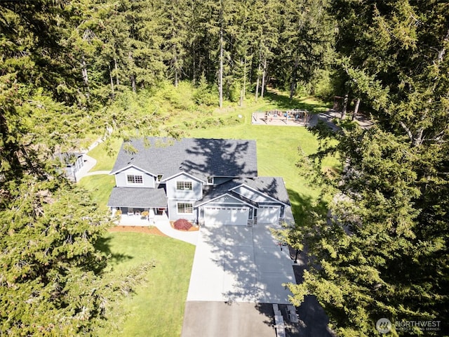 view from above of property featuring a forest