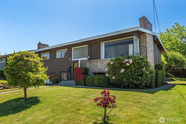 4839 S Mead St, Seattle, WA 98118 - bi-level home with a chimney and a front yard