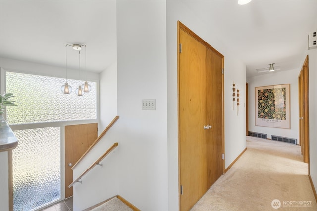 4839 S Mead St, Seattle, WA 98118 - hall featuring an upstairs landing, carpet flooring, and baseboards