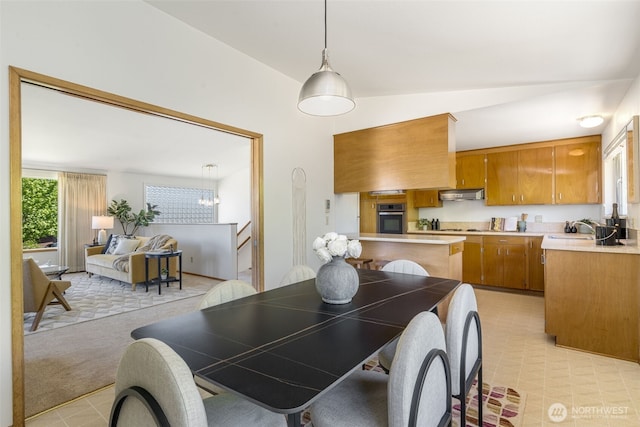 4839 S Mead St, Seattle, WA 98118 - dining space featuring vaulted ceiling and light colored carpet
