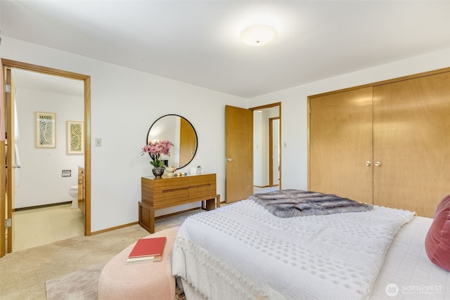 4839 S Mead St, Seattle, WA 98118 - bedroom featuring light colored carpet, a closet, ensuite bath, and baseboards
