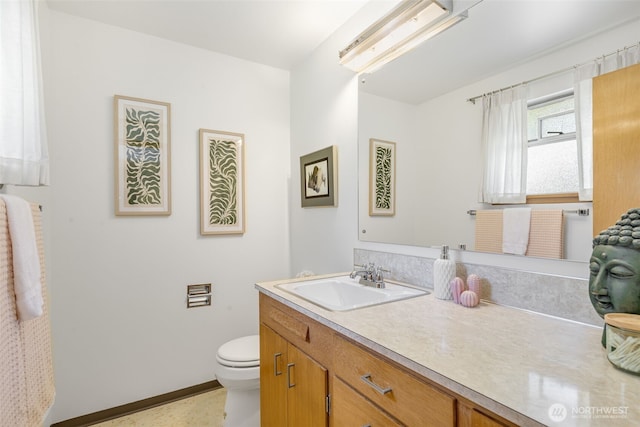 4839 S Mead St, Seattle, WA 98118 - bathroom featuring vanity, toilet, and baseboards