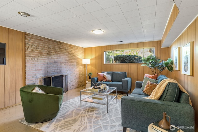 4839 S Mead St, Seattle, WA 98118 - living area featuring wood walls and a brick fireplace