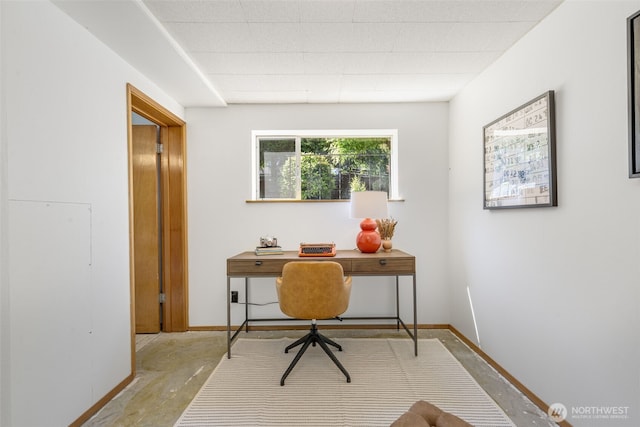 4839 S Mead St, Seattle, WA 98118 - office area with baseboards and concrete floors
