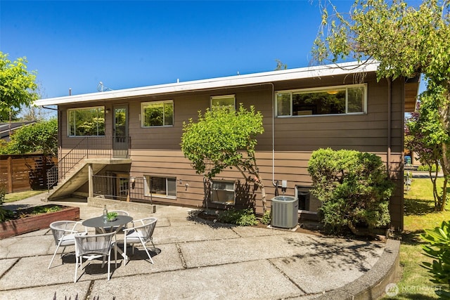 4839 S Mead St, Seattle, WA 98118 - rear view of house featuring a patio and stairway