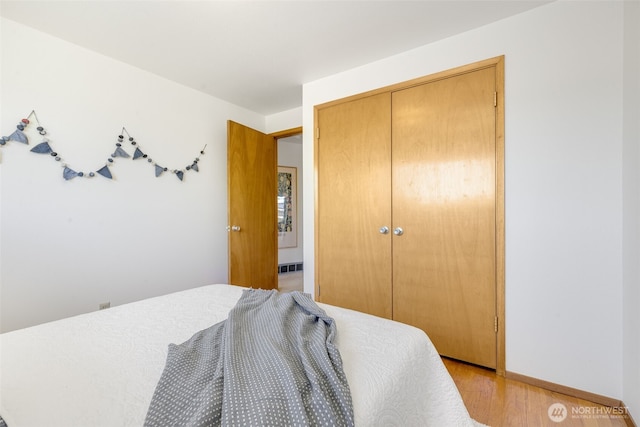 4839 S Mead St, Seattle, WA 98118 - bedroom with a closet, light wood-type flooring, and baseboards