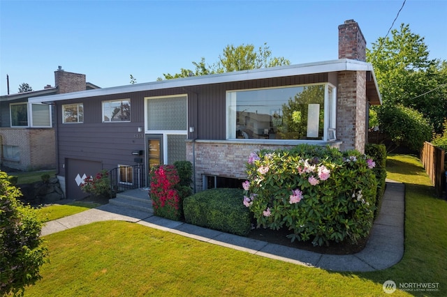 4839 S Mead St, Seattle, WA 98118 - view of front of home with a chimney and a front lawn