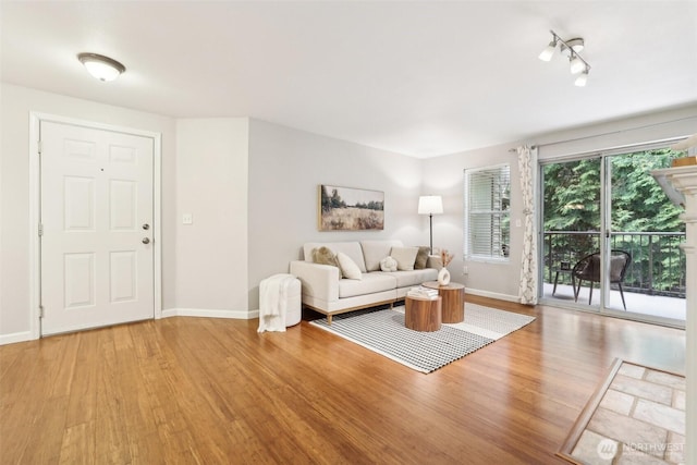 13209 Newcastle Way Unit A308, Newcastle, WA 98059 - living area with light wood-style floors and baseboards