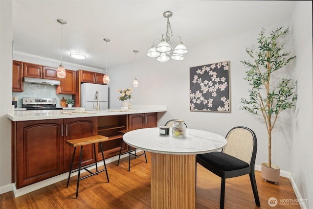13209 Newcastle Way Unit A308, Newcastle, WA 98059 - dining area with wood finished floors, a chandelier, and baseboards