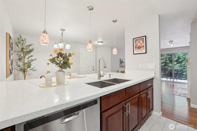 13209 Newcastle Way Unit A308, Newcastle, WA 98059 - kitchen featuring a sink, stainless steel dishwasher, decorative light fixtures, and light stone counters