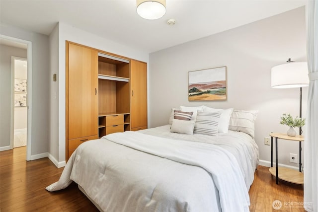 13209 Newcastle Way Unit A308, Newcastle, WA 98059 - bedroom featuring wood finished floors, a closet, and baseboards