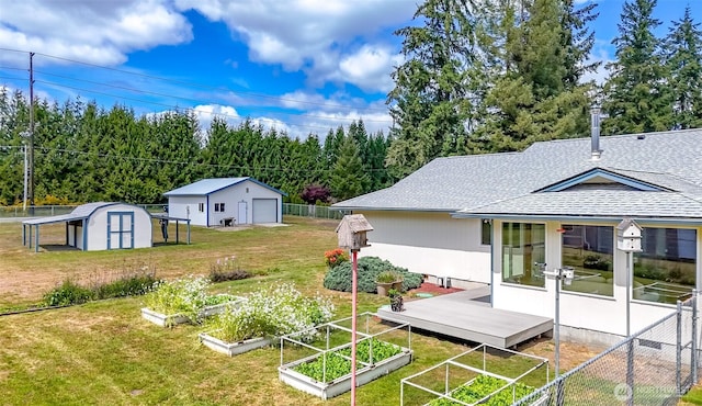 view of yard with a garden and a garage