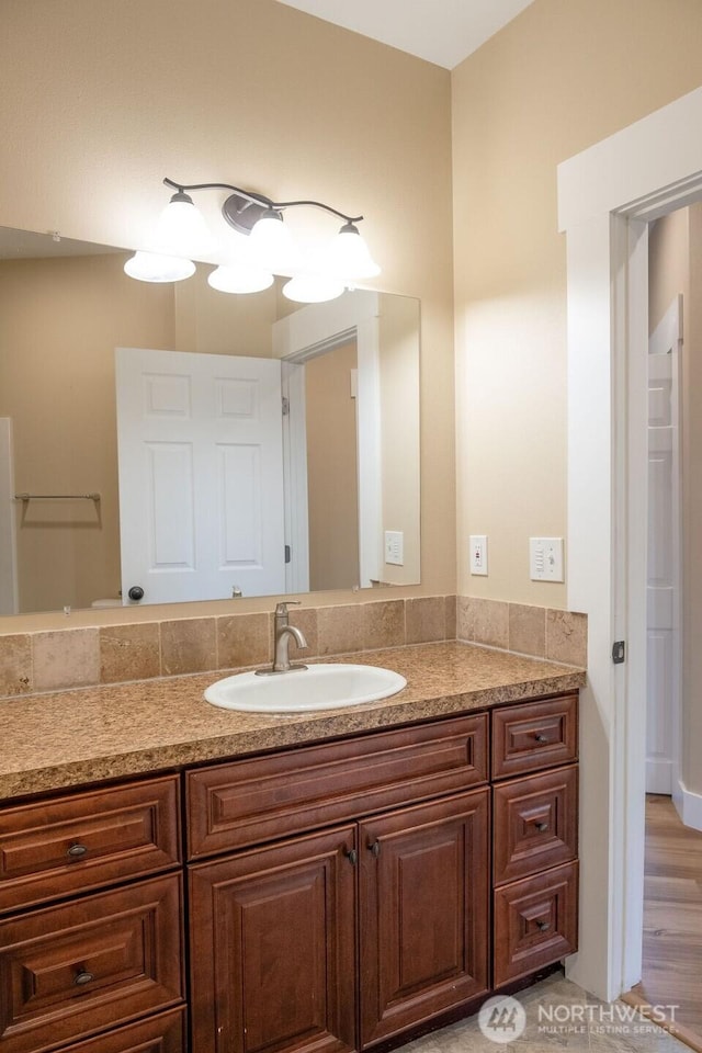 bathroom featuring vanity and wood finished floors