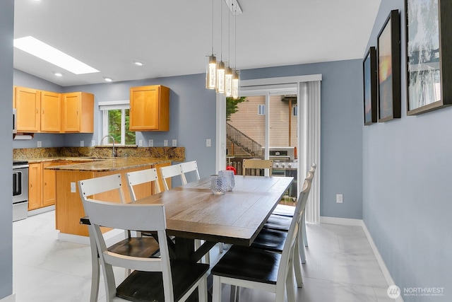 17421 73rd Ave NE, Arlington, WA 98223 - dining area featuring light marble finish flooring, baseboards, recessed lighting, and lofted ceiling