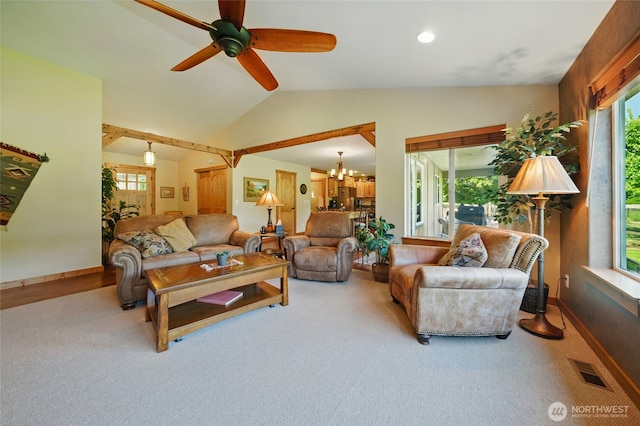 52 Buttonquail Ln, Walla Walla, WA 99362 - carpeted living area with lofted ceiling, a ceiling fan, baseboards, and a chandelier