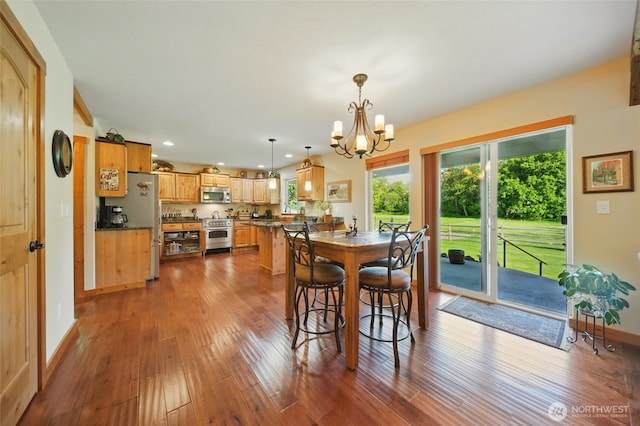 52 Buttonquail Ln, Walla Walla, WA 99362 - dining space featuring a chandelier, wood finished floors, recessed lighting, and baseboards