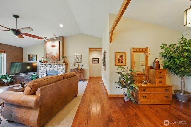 52 Buttonquail Ln, Walla Walla, WA 99362 - living room with lofted ceiling, ceiling fan, wood finished floors, a fireplace, and baseboards