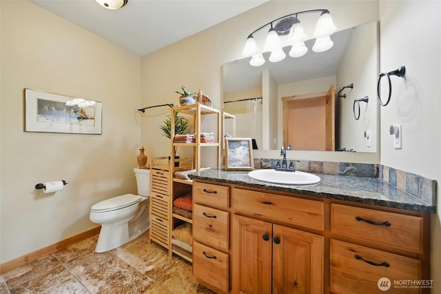 52 Buttonquail Ln, Walla Walla, WA 99362 - bathroom featuring toilet, vanity, baseboards, and a shower with shower curtain