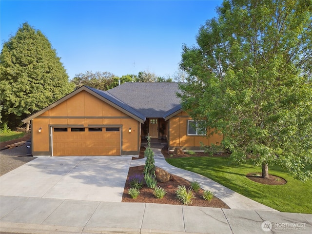 52 Buttonquail Ln, Walla Walla, WA 99362 - view of front of house featuring an attached garage, driveway, and a front lawn