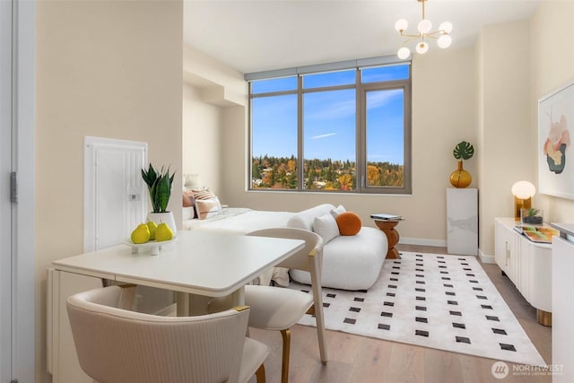 10232 NE 10th St Unit 506, Bellevue, WA 98004 - office space featuring light wood-style floors, a chandelier, and baseboards