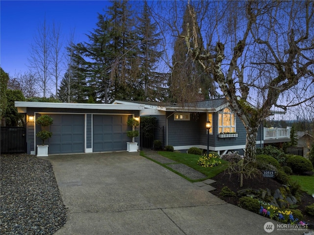 single story home featuring driveway and a garage