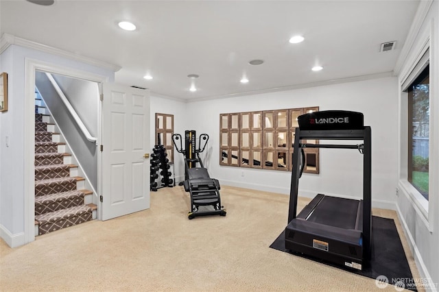 exercise room with carpet floors, crown molding, recessed lighting, and baseboards