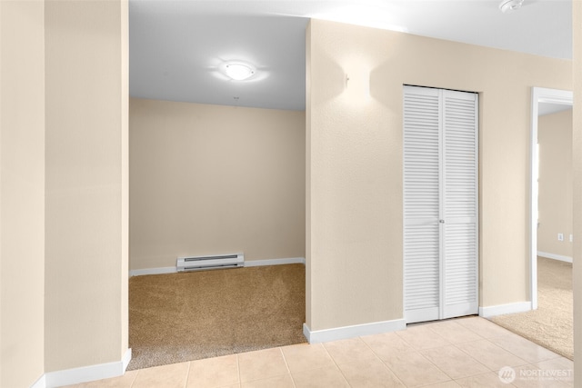 303 23rd Ave S Unit 308, Seattle, WA 98144 - hall with a baseboard radiator, carpet, baseboards, and tile patterned floors