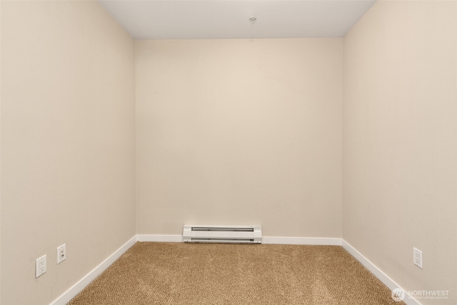 303 23rd Ave S Unit 308, Seattle, WA 98144 - carpeted spare room featuring a baseboard radiator and baseboards