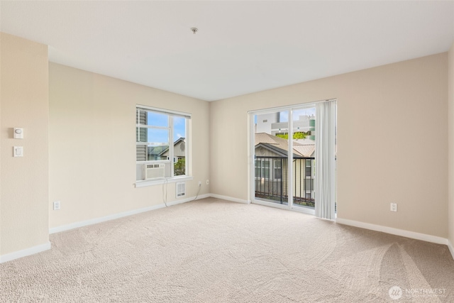 303 23rd Ave S Unit 308, Seattle, WA 98144 - carpeted empty room featuring healthy amount of natural light, baseboards, and a pendent fire sprinkler