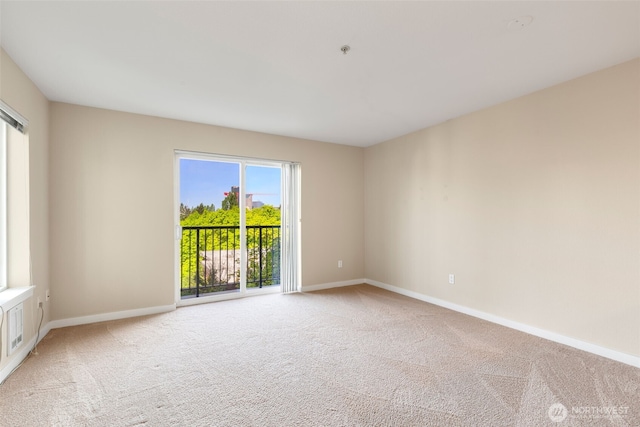 303 23rd Ave S Unit 308, Seattle, WA 98144 - spare room with carpet, baseboards, and a pendent fire sprinkler