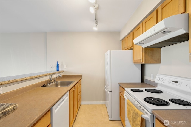 303 23rd Ave S Unit 308, Seattle, WA 98144 - kitchen featuring white appliances, under cabinet range hood, a sink, light tile patterned floors, and light countertops