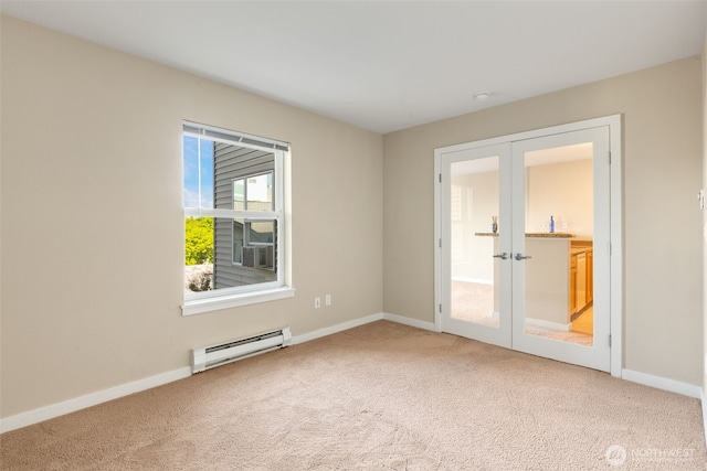 303 23rd Ave S Unit 308, Seattle, WA 98144 - carpeted spare room with french doors, baseboard heating, and baseboards