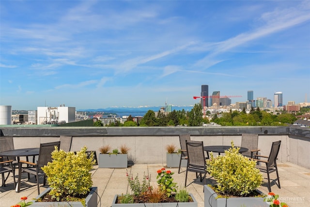 303 23rd Ave S Unit 308, Seattle, WA 98144 - view of patio / terrace with a view of skyline