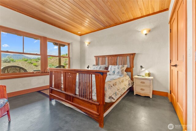 3B Johnny Haase Ln, Winthrop, WA 98862 - bedroom featuring wood ceiling, concrete flooring, baseboards, and crown molding
