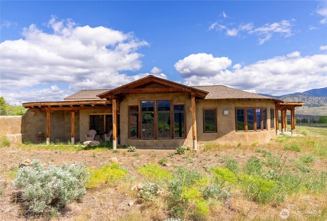 3B Johnny Haase Ln, Winthrop, WA 98862 - back of property with a mountain view and stucco siding