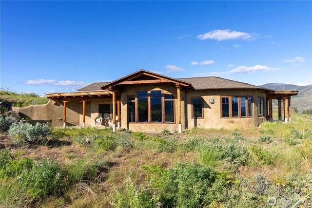 3B Johnny Haase Ln, Winthrop, WA 98862 - rear view of property featuring stucco siding and a mountain view