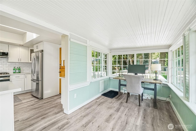 746 N 89th St, Seattle, WA 98103 - office area with healthy amount of natural light and light wood finished floors