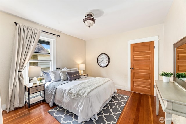 746 N 89th St, Seattle, WA 98103 - bedroom featuring dark wood-style flooring and baseboards